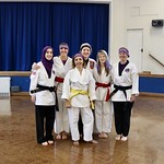 Group of young people in taekwondo outfits