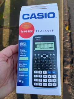 A scientific calculator in its box